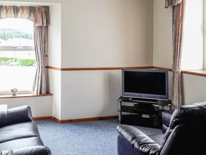 Living room/dining room | Sunset Cottage - Bron Y Wendon Holiday Park, Llanddulas, near Llandudno