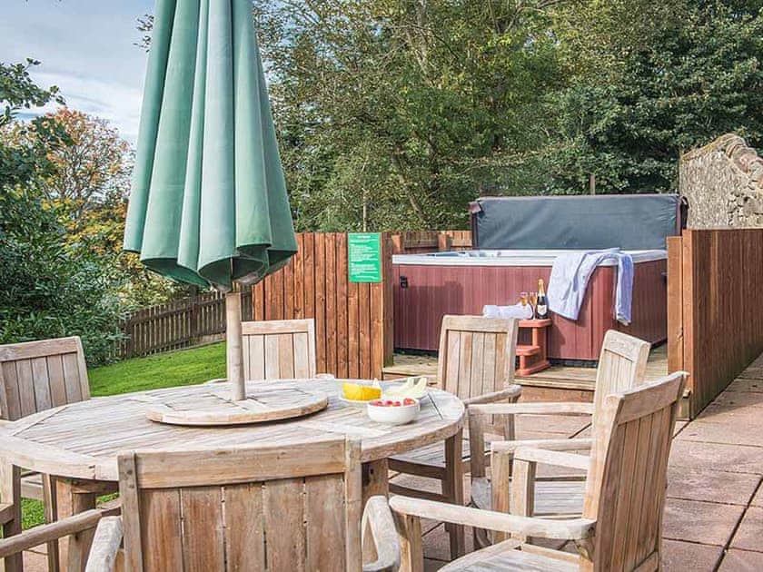 Outdoor area with hot tub | The Granary - Rossie Ochil Estate, Forgandenny