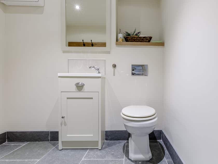 Downstairs WC with plenty of room for coats and storage | Willow Cottage at Naze Farm - Naze Farm, Chinley
