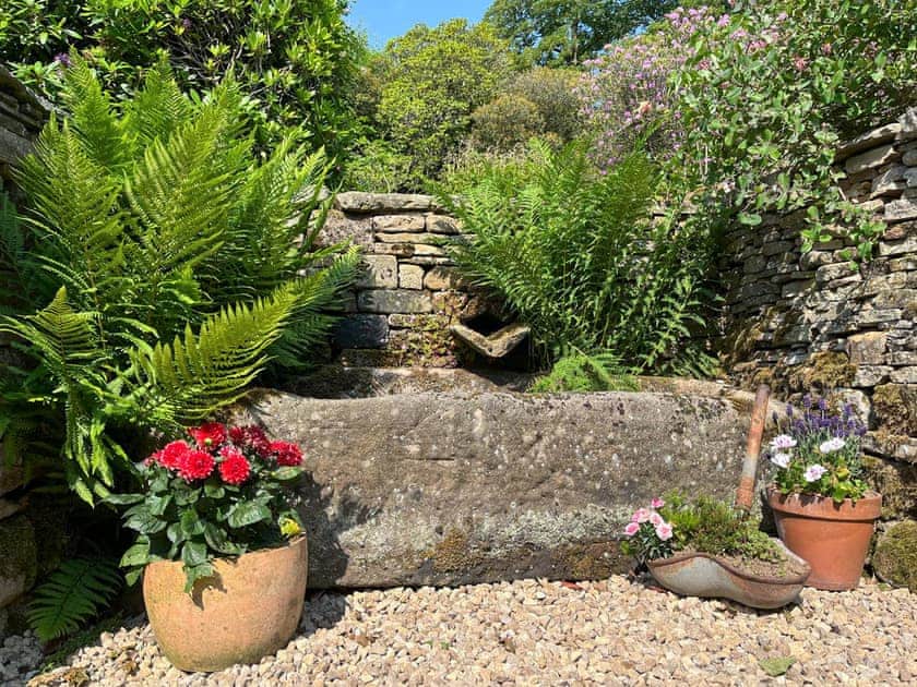 Originally a working farm, the property dates back to 1640 and there are still some original features here. Willow Cottage is formed from part of the old milking barn | Willow Cottage at Naze Farm - Naze Farm, Chinley