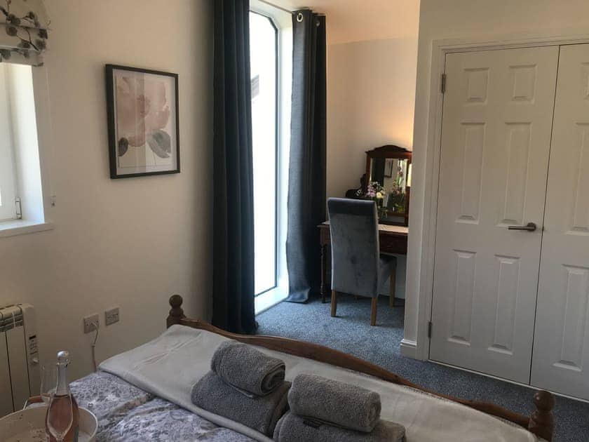 Double bedroom 2 with dressing table | Clock Tower Cottage, Whitchurch