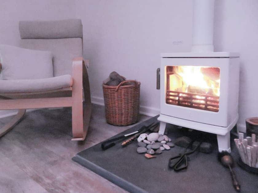 Warming wood burner | Sea View, Deganwy, near Llandudno