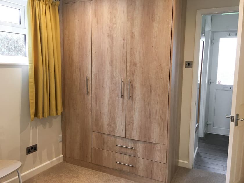 Dressing area with ample storage in double bedroom | Puffins, Port Isaac