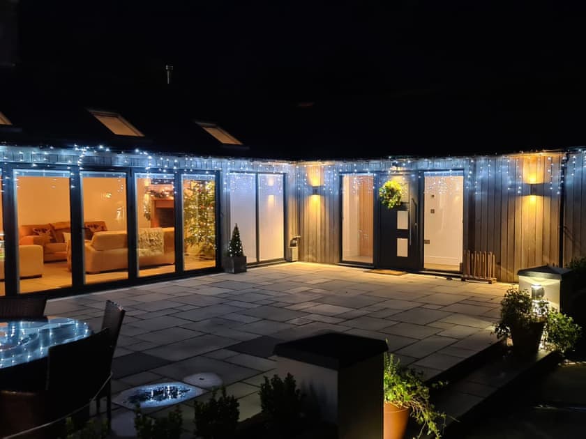 Outdoor area illuminate in the evening | Farmhouse Cottage - Colley Mill Farm, North Rode