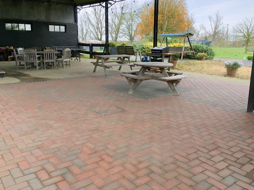 Covered outdoor communal recreation area | Pheasant - Caves Farm Barns, Near Ely