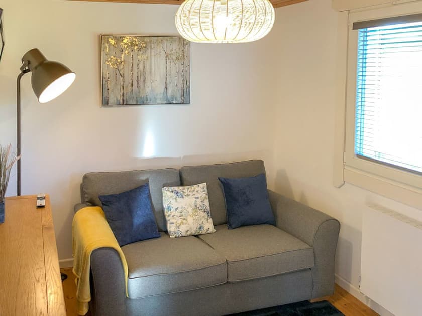 Bedroom 1 Snug downstairs with double sofa bed | Heron Lodge, Five Roads, near Llanelli