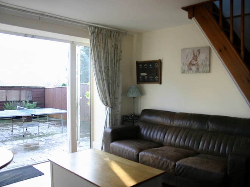 Living/dining room with French doors to the patio | Woodside Cottage, Near Easington