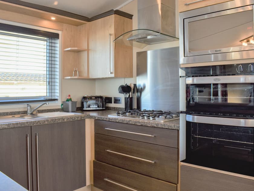 Kitchen area | Victoria Lodge - Bron Y Wendon Holiday Park, Llanddulas, near Llandudno