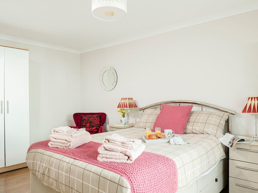 Double bedroom that leads into the conservatory | Dylmor, Benllech 