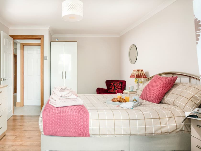 Double bedroom that leads into the conservatory | Dylmor, Benllech 