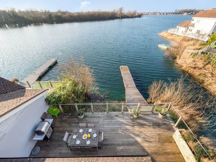 View over the terrace to the lake | Wrens Lake House, South Cerney, Cotswolds near Cirencester