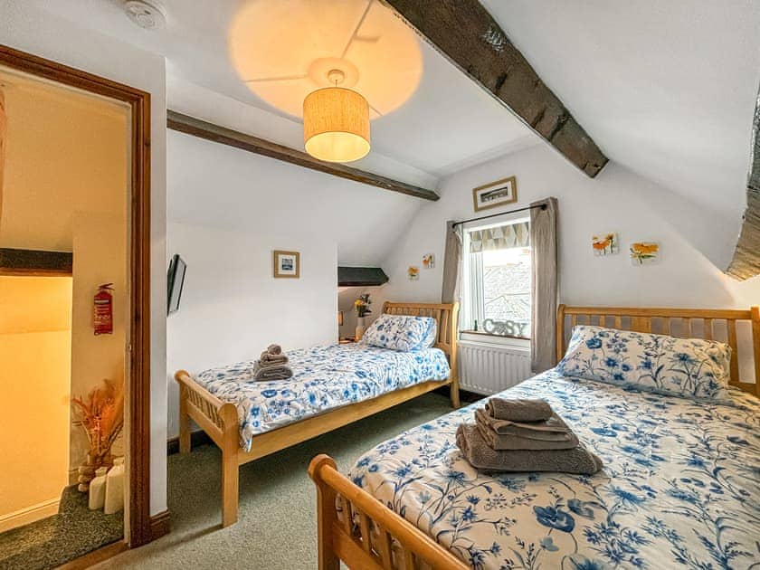 Comfortable twin bedroom with wardrobe | Lavender Cottage, Keswick