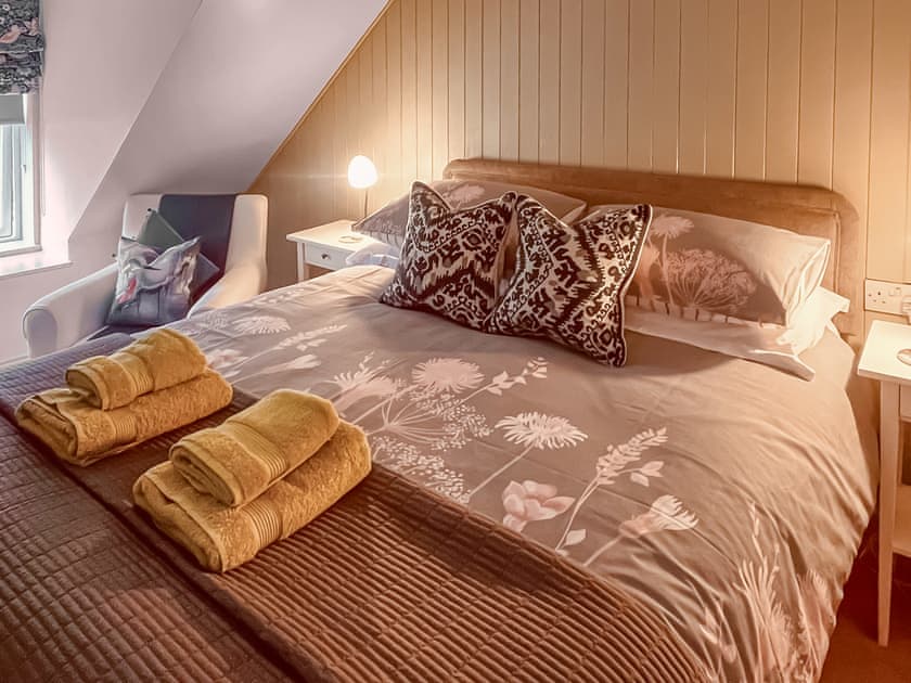 Beautifully decorated double bedroom with kingsize bed | 2 Northbank Cottages, Whiting Bay, Isle of Arran