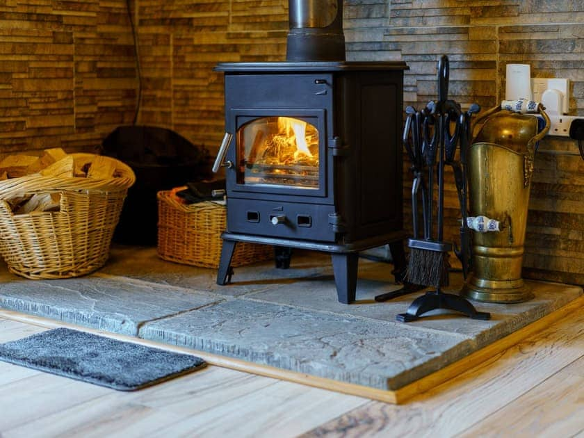 Woodburner in the living area | Red Kite Cottage, Maesymeillion, near New Quay