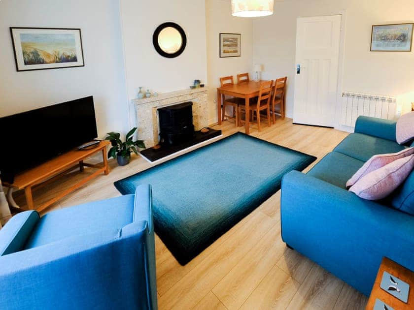 Living room with dining area | Fisher’s Cottage, Balintore, near Tain