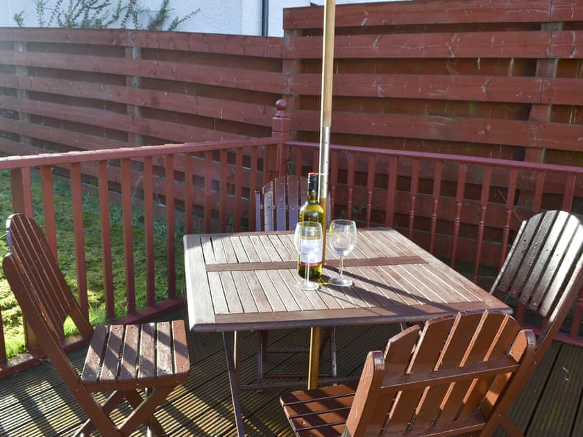Sitting-out-area. There is also a Weber portable BBQ for outside dining. A selection of outdoor garden games provided for sunny days  | Riverside Cottage, Drumnadrochit, near Loch Ness