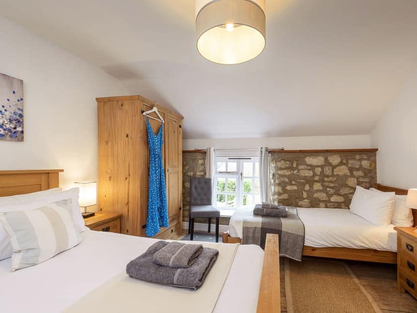 Double bedroom with an additional single bed | The Old Mill - Somerset Country Escape, Wrantage, near Taunton