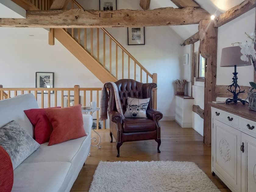 A view across the sitting area to the gallery staircase | The Barn at Titley, Titley, near Kington