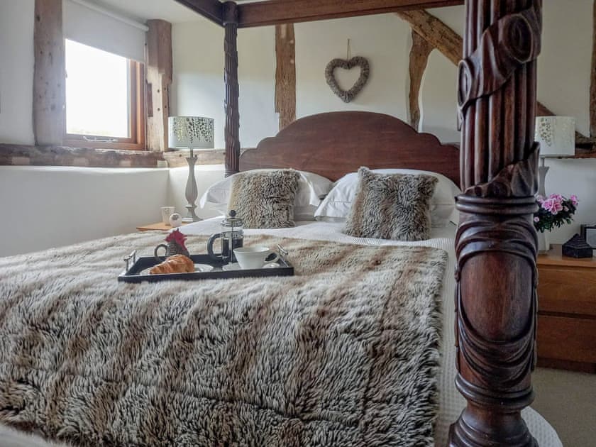 A bespoke king size four posteren-suite bedroom | The Barn at Titley, Titley, near Kington