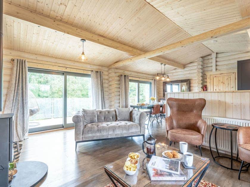 Living area | Treetops Log Cabin, Kippford, near Sandyhills