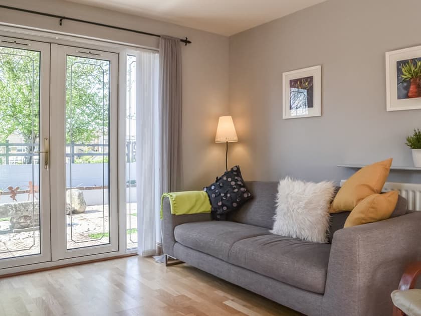 Living area with views over rear patio areas | Pippin Howe, Seaton