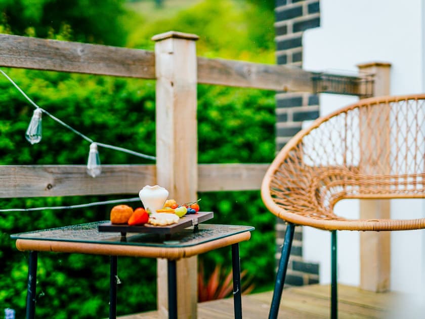 Sitting-out-area | Cwtch Enrico - Hen Efail Holiday Cottages, Furnace, near Machynlleth