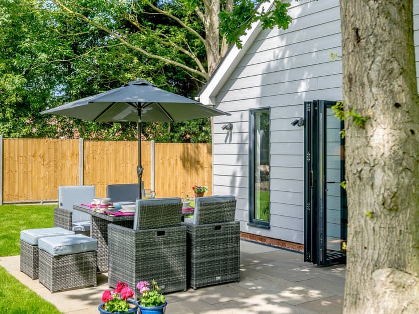 Outdoor area with table chairs | Willow Cottage, Stonham, near Needham Market