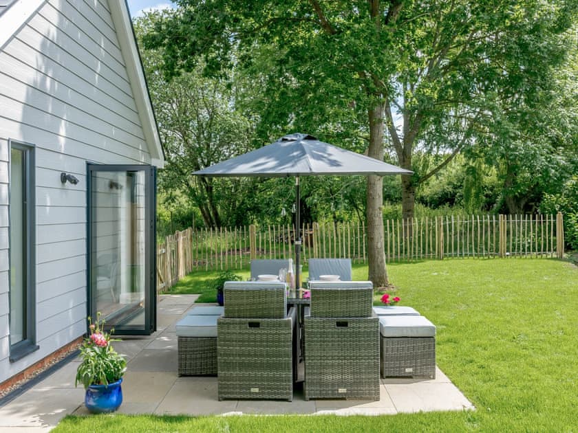 Outdoor area with table chairs | Willow Cottage, Stonham, near Needham Market