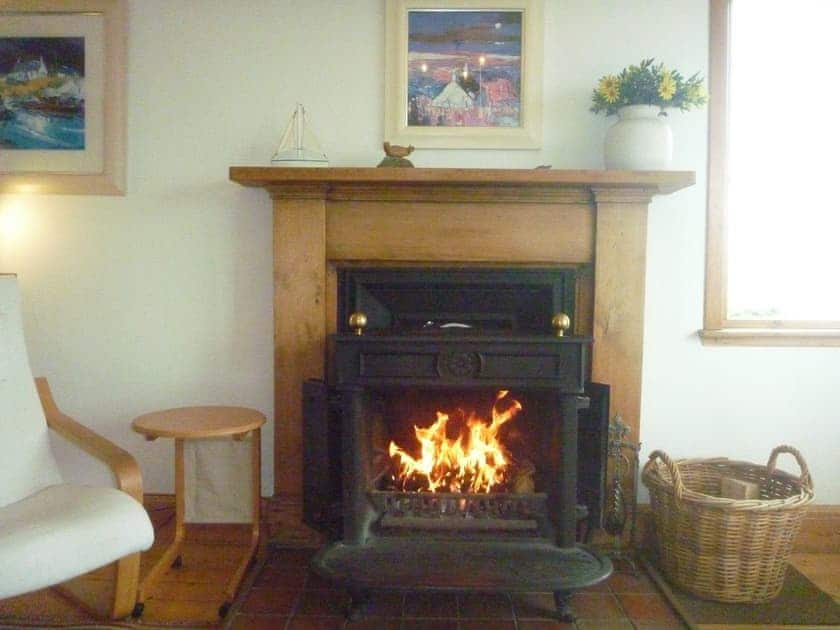 Fireplace with cosy wood burner | Tigh an Uillt, Strachur, near Inveraray