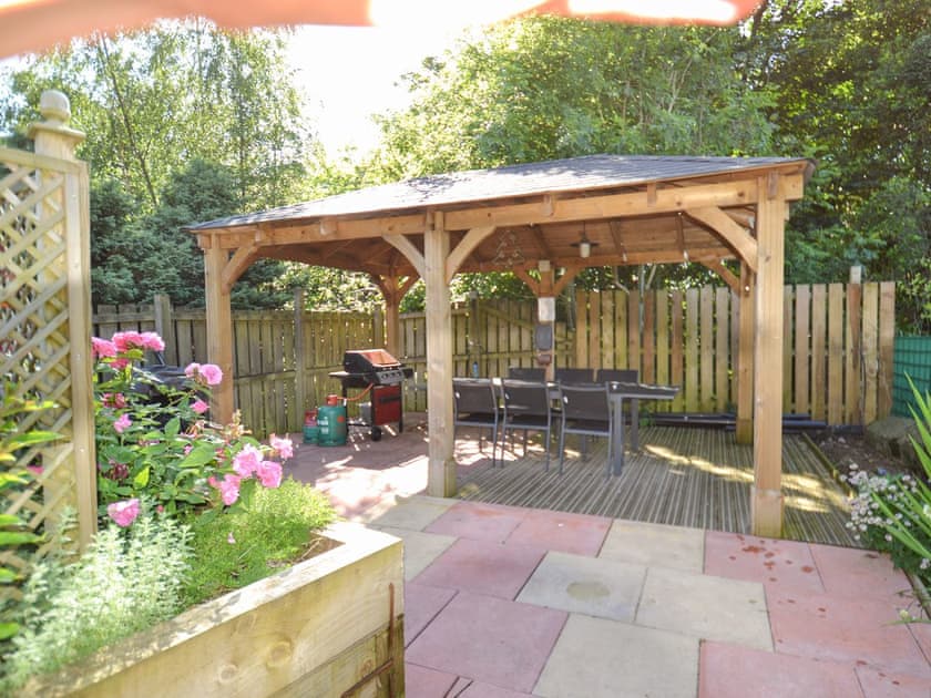 Paved garden with terraces, ramps and railings throughout | The Moat House, Annan