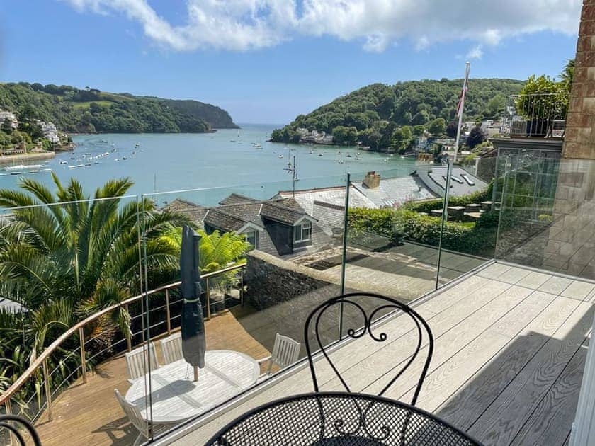 Water views over the decked balcony from the bedroom | Oystercatcher , Dartmouth