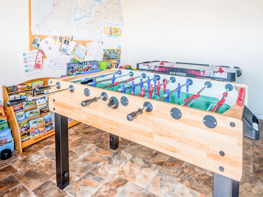 Shared games room and tourist information | Millers Rest, Trewin Court, Rivendell Glamping Pod - Well Farm Holiday Cottages, Holsworthy, near Launceston