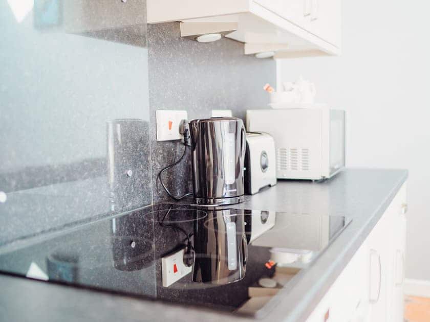 Kitchen | Gardener’s Cottage - Celtic Haven Resort, Lydstep, near Tenby
