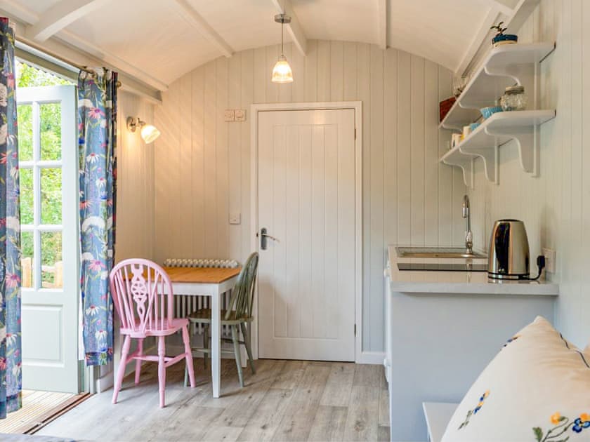 Open plan living space | Fig Tree Shepherd’s Hut, Bridport
