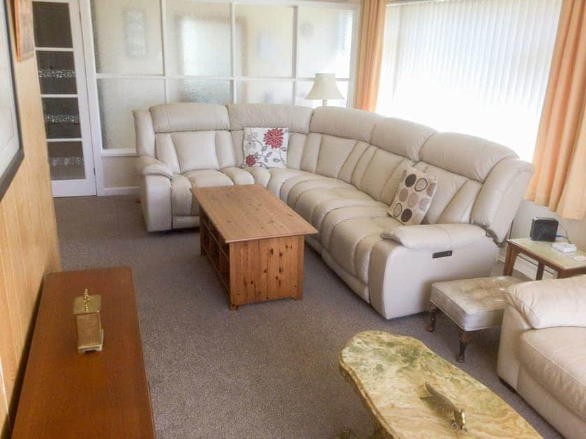 Plentiful seating including leather reclining corner settee with DVD and Freeview TV. | Dart Corner, Bovey Tracey