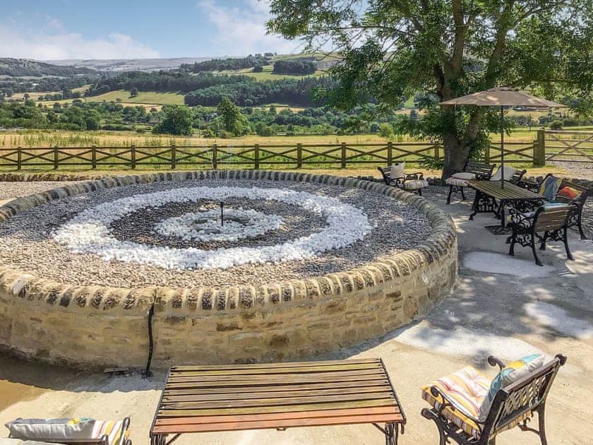 Seating next to fountain | The Stables, Stanhope