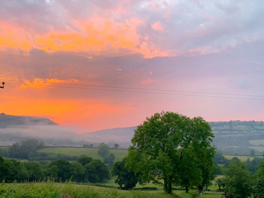 Watch the sun setting as you relax in the garden | Dairy Cottage - Carmarthen Cottages, Cwmdu, Near Llandeilo