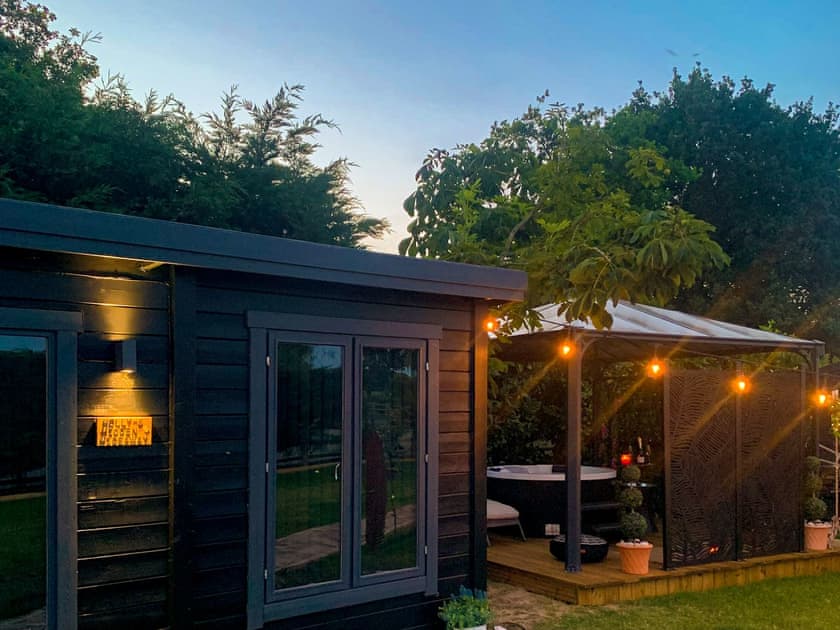 Outdoor area at night | Holly’s Hidden Hideaway - Lower Farm Lodges, Chart Sutton, near Maidstone