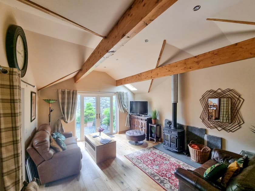 Cosy living room with access to the garden | Stonecroft Cottage - Wreaks End Farm, Broughton-in-Furness