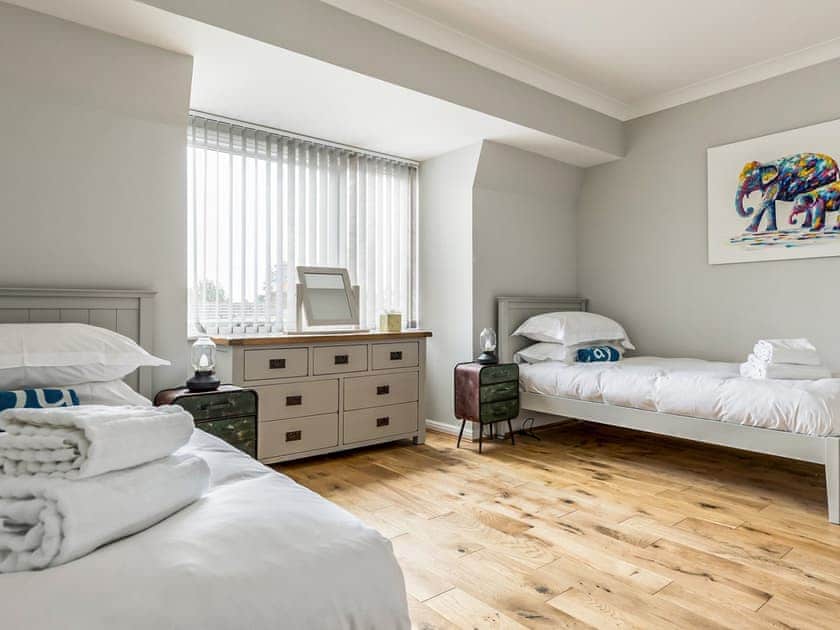 Twin bedroom | Candle Island View, Poole