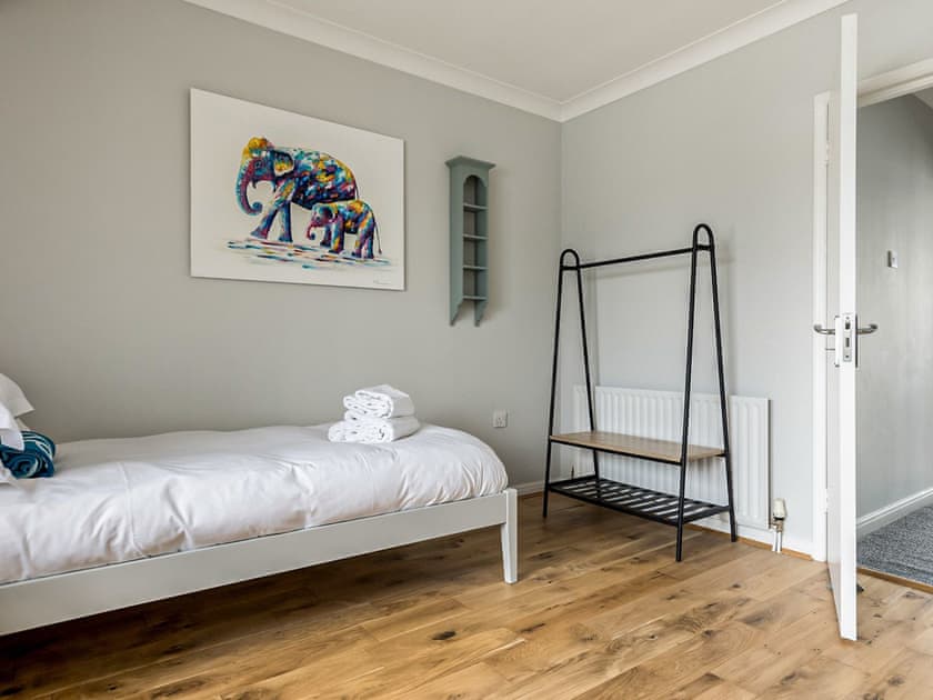 Twin bedroom | Candle Island View, Poole