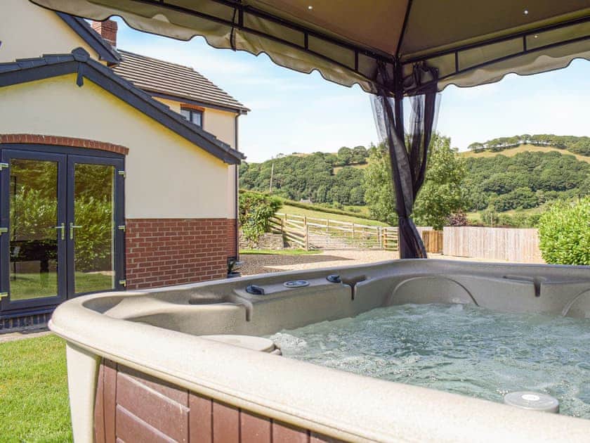 Hot tub | Hill View Lodge - Mill Farm Holiday Cottages, Heyope, near Knighton