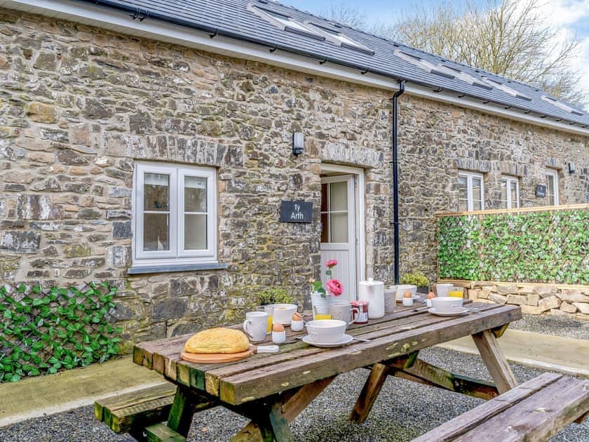 Outdoor eating area | Ty Arth - Llwynwermod Cottages, Maen-y-groes, near New Quay