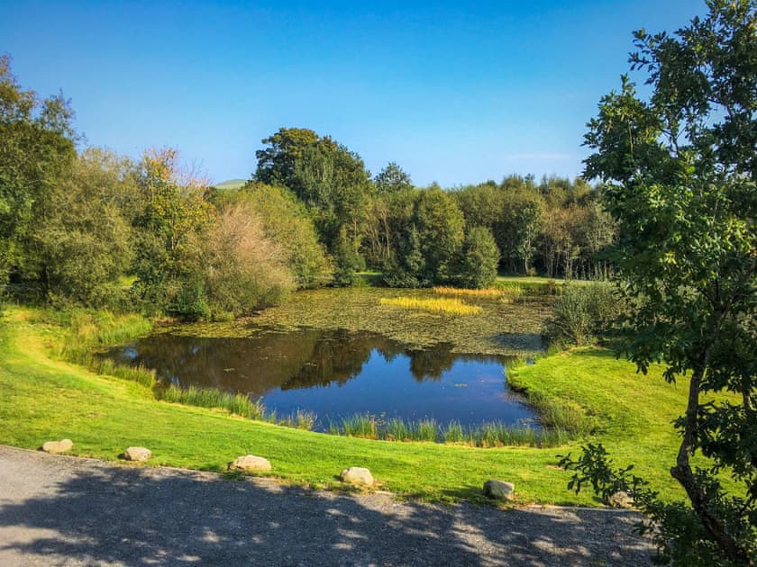Lakeside balcony view lake | Lakeside Lodge, near Rhayader
