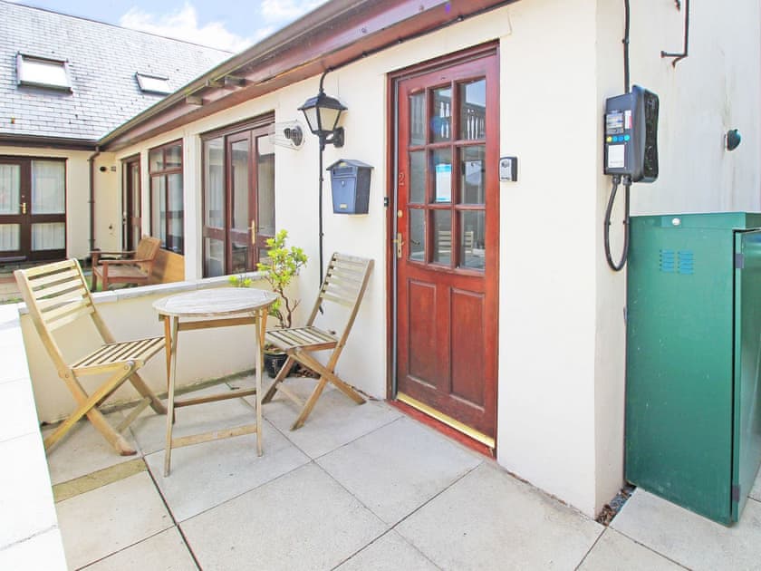 Exterior and black EV charger next to the front door | Fisherman Cove, Porthmadog