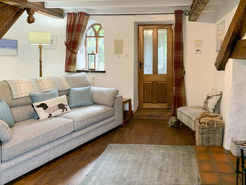 Snug lounge  with wood burner | Keepers Cottage, Red Wharf Bay