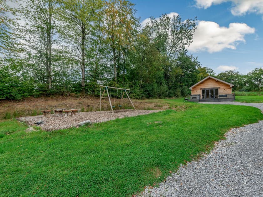 Children’s play area | Dwrgi - Glanyrafon Lodges, Cwrt Newydd, near Llandysul