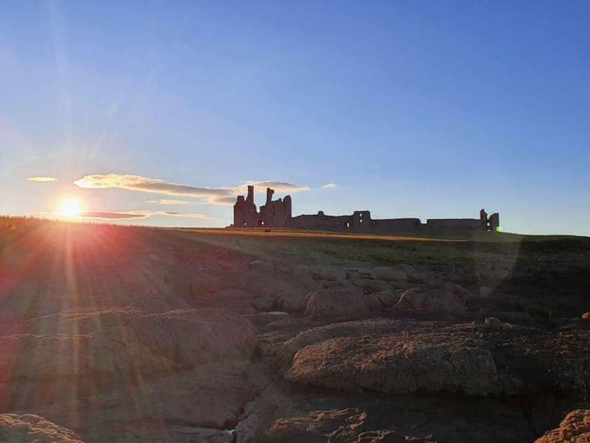 Dunstanburgh Castle 30 mins drive away | Valley View Cottage, Fairway View Cottage, Beech Cottage - Copper Beech Cottages, Rothbury