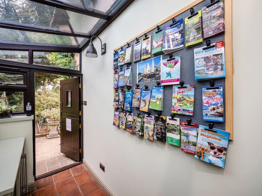 Boot room with wine fridge and tourist information | The Norfolk Broads CottageFarthings, Wroxham