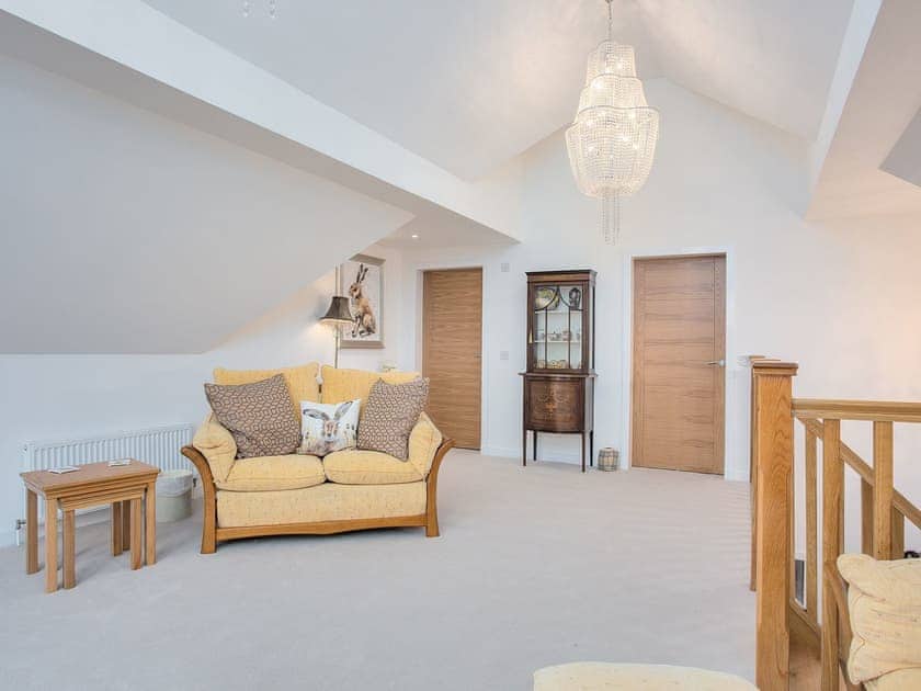 Living room with doors to bedroom 2 and shower room | Orchard House - Blinkbonny Cottages, Auchtermuchty